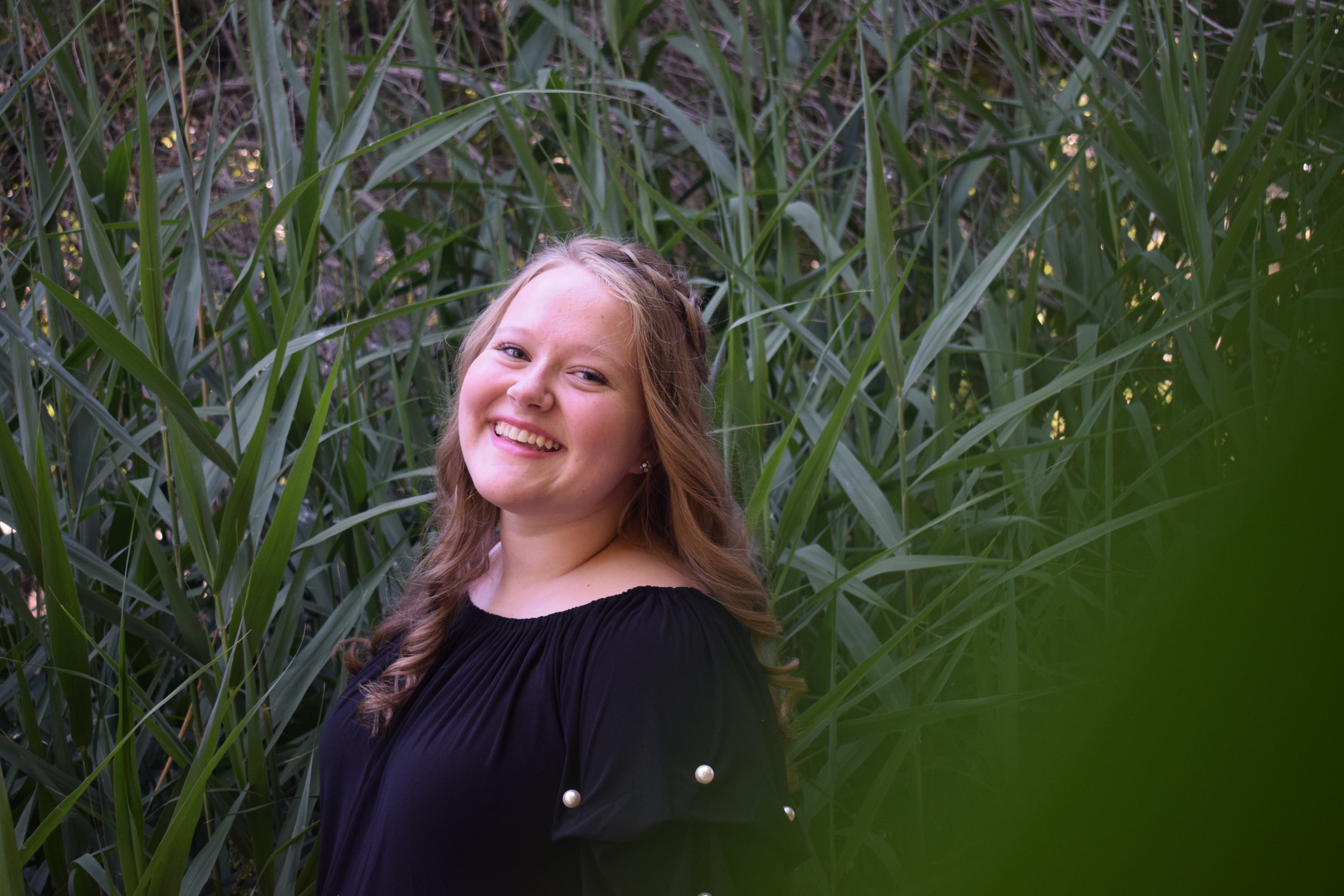 Brittany sitting on bench